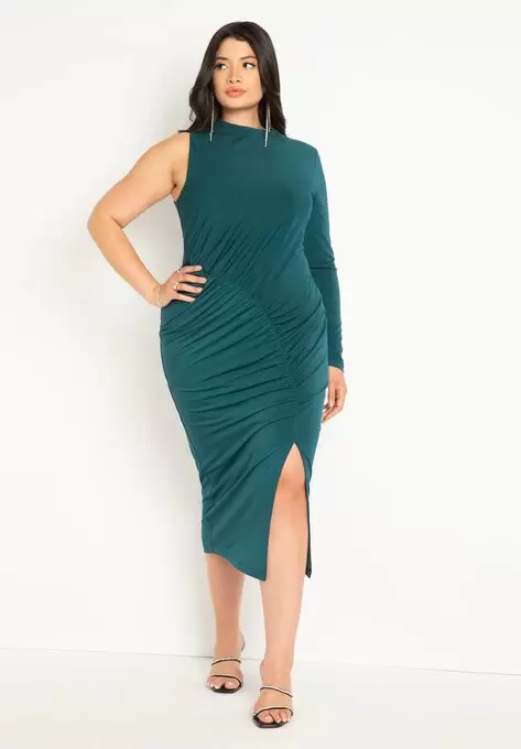 woman wearing eloquii one shoulder dress with slit with one hand on hip